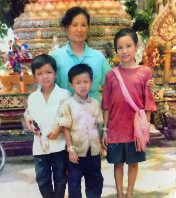 Chitphavan as a young girl with her mother and brothers